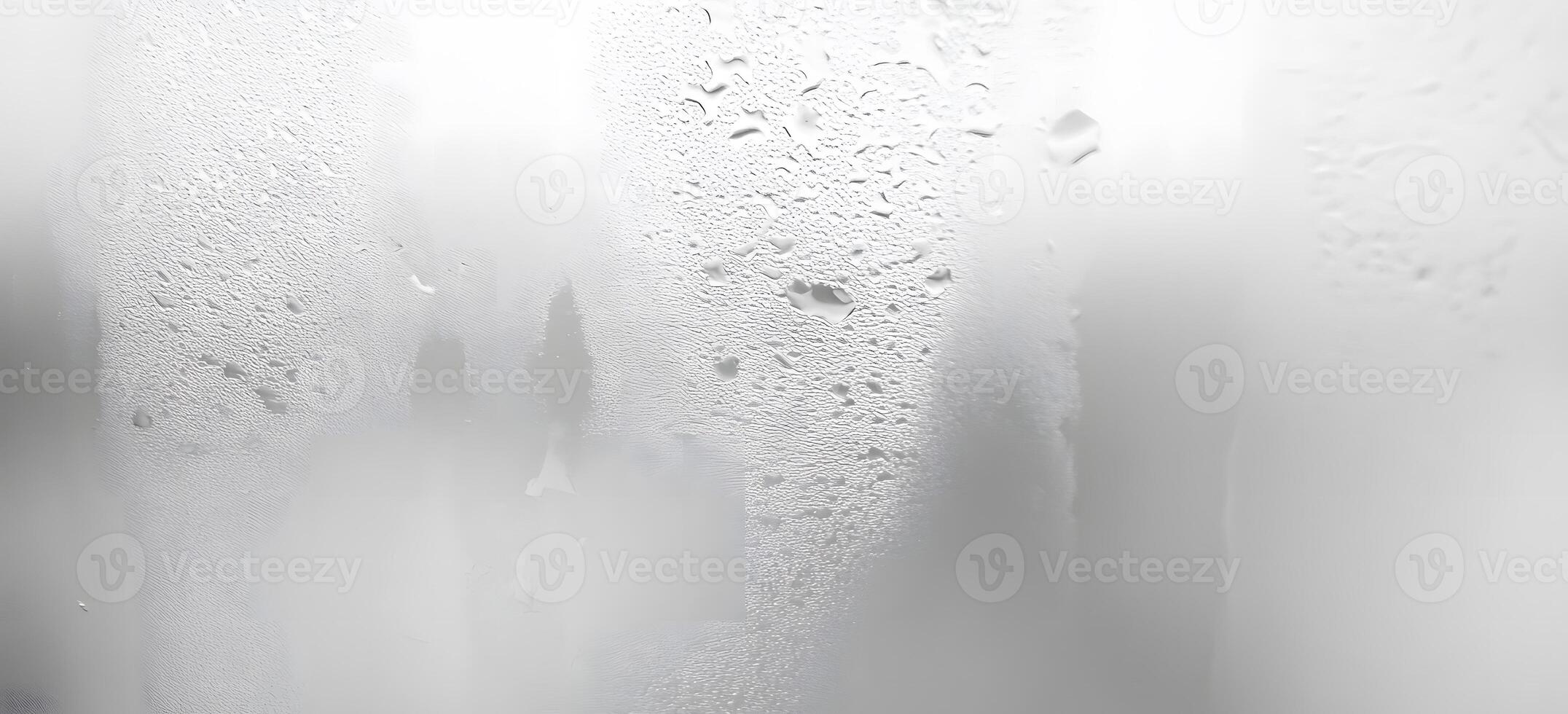 Condensation forms intricate patterns of water droplets across a translucent, textured glass surface photo