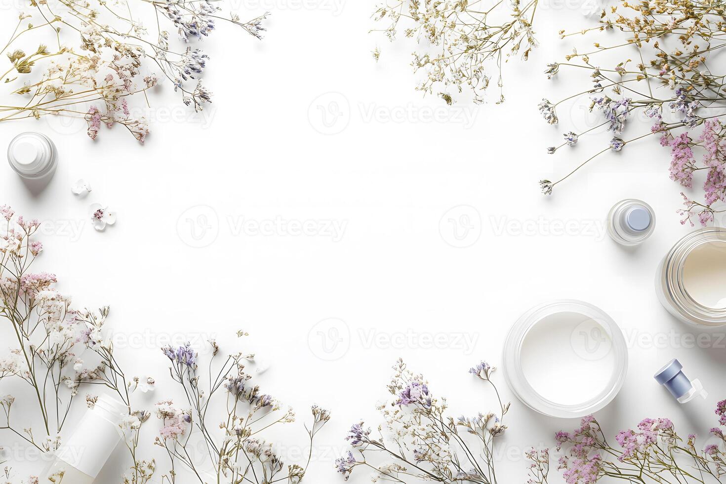 Cosmetic products and dried gypsophila create a delicate floral frame on a clean white surface photo