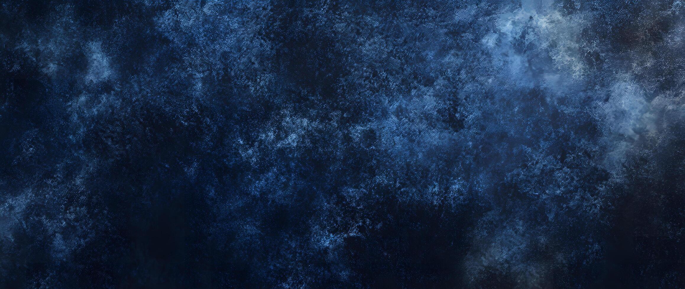Dark blue textured background exhibits an irregular pattern and varying shades of depth,creating intrigue photo