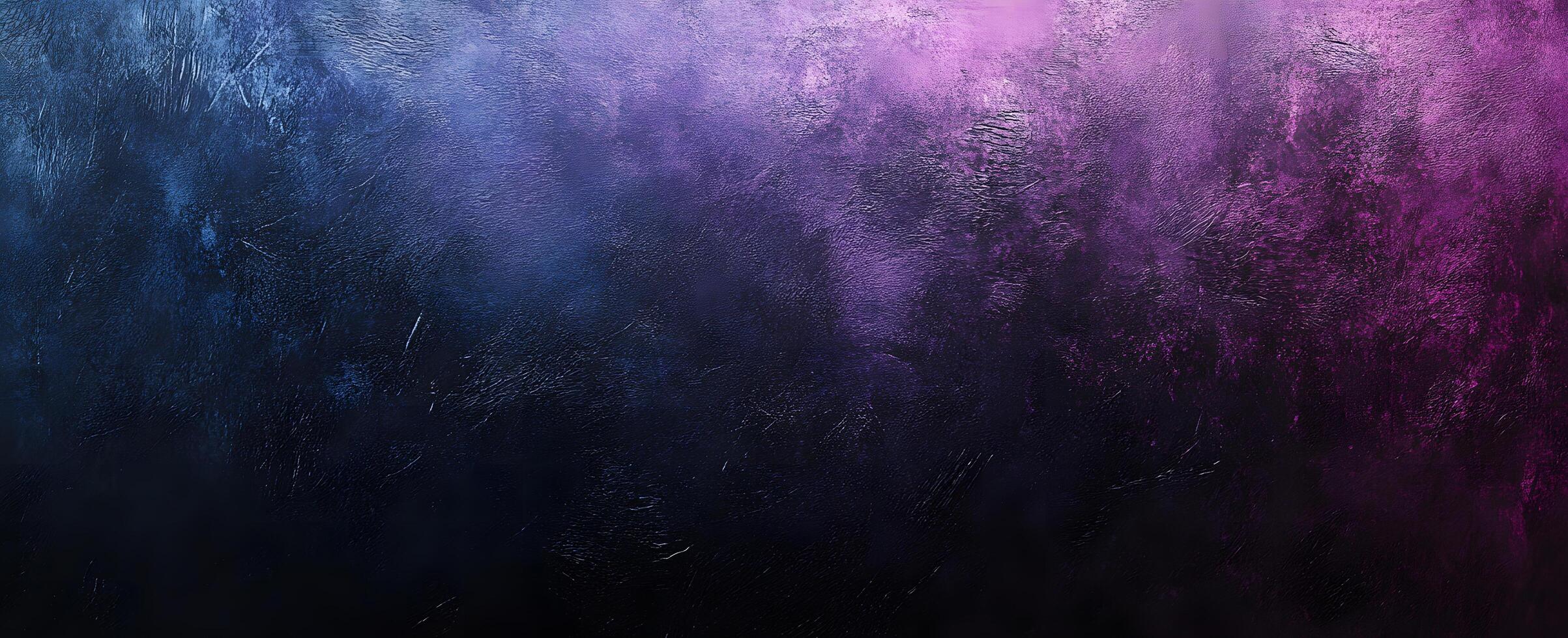 Dark textured background featuring blue gradually transitioning into violet and pink hues creates depth photo