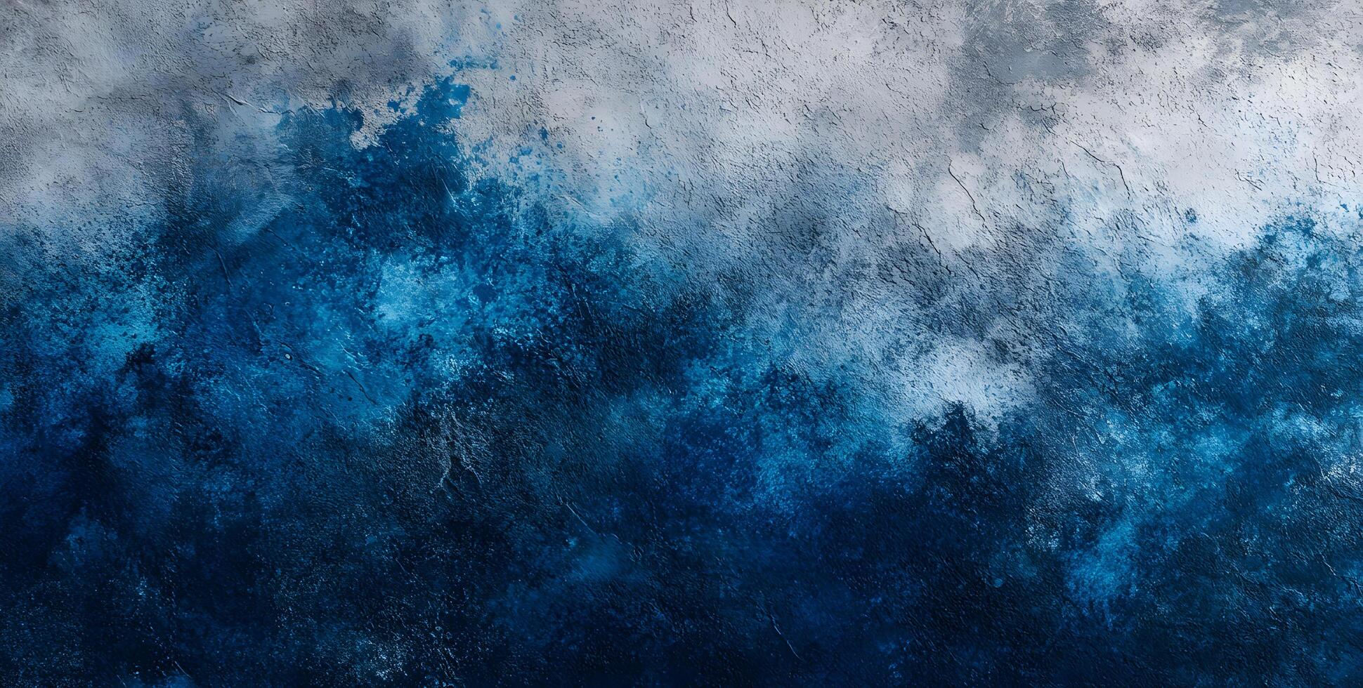 Deep blue merges into a textured gray like an ocean horizon in abstract art photo