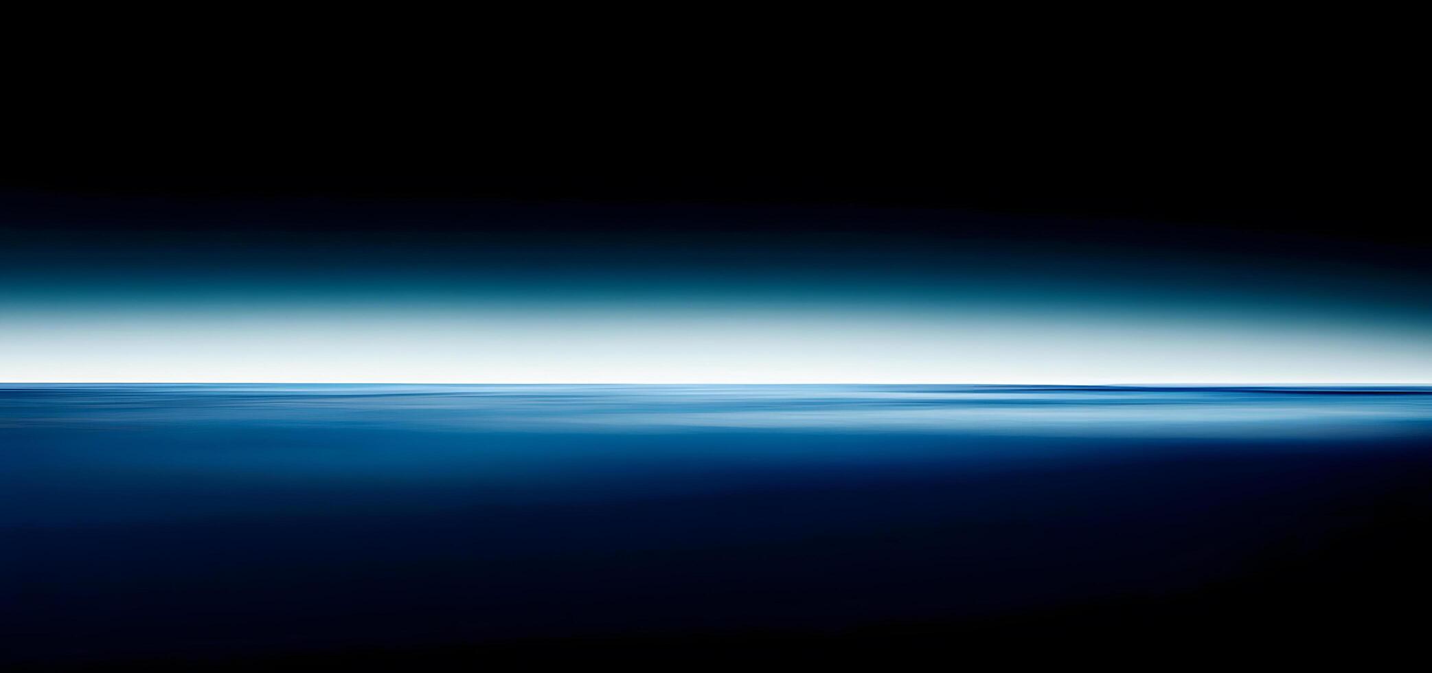 Deep blue water meets a gradient sky in this serene abstract ocean scene photo