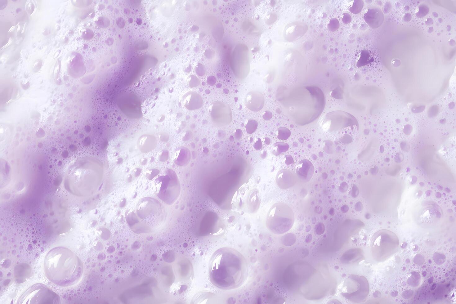 Delicate lilactinted bubbles and foam form a visually captivating, textured surface in closeup photo