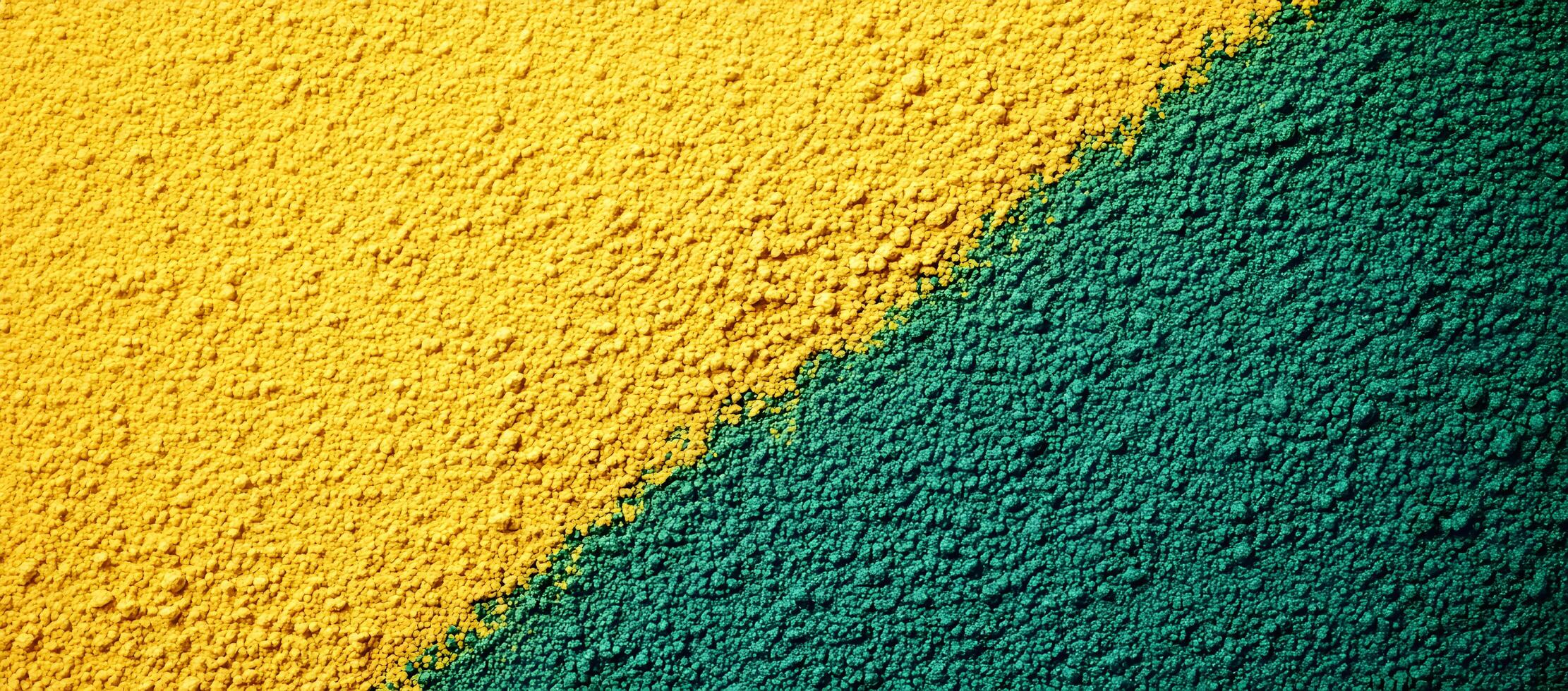 Diagonal textural divide features golden yellow and emerald green powder in macro detailed view photo