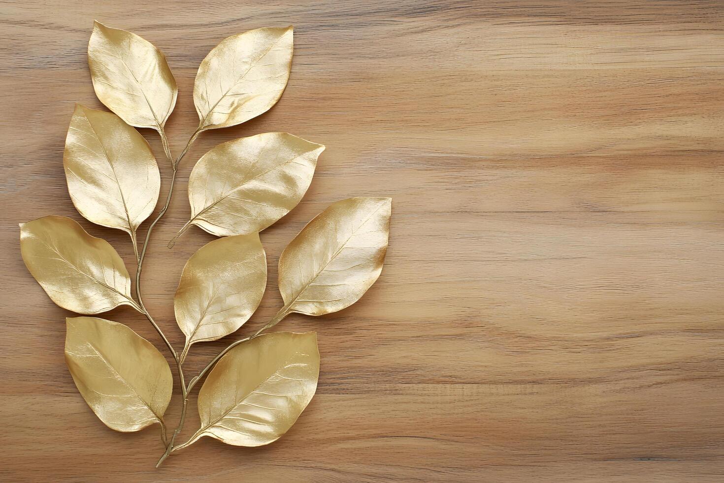 Golden leaves arranged on a wood surface create a luxurious and opulent design backdrop photo