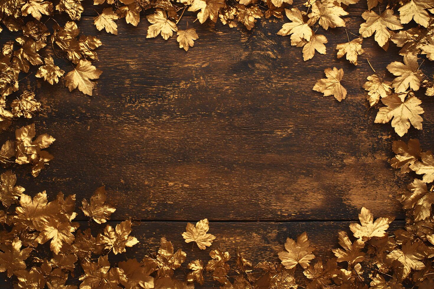 Golden leaves meticulously frame the rich dark wood background creating a luxurious and elegant border photo