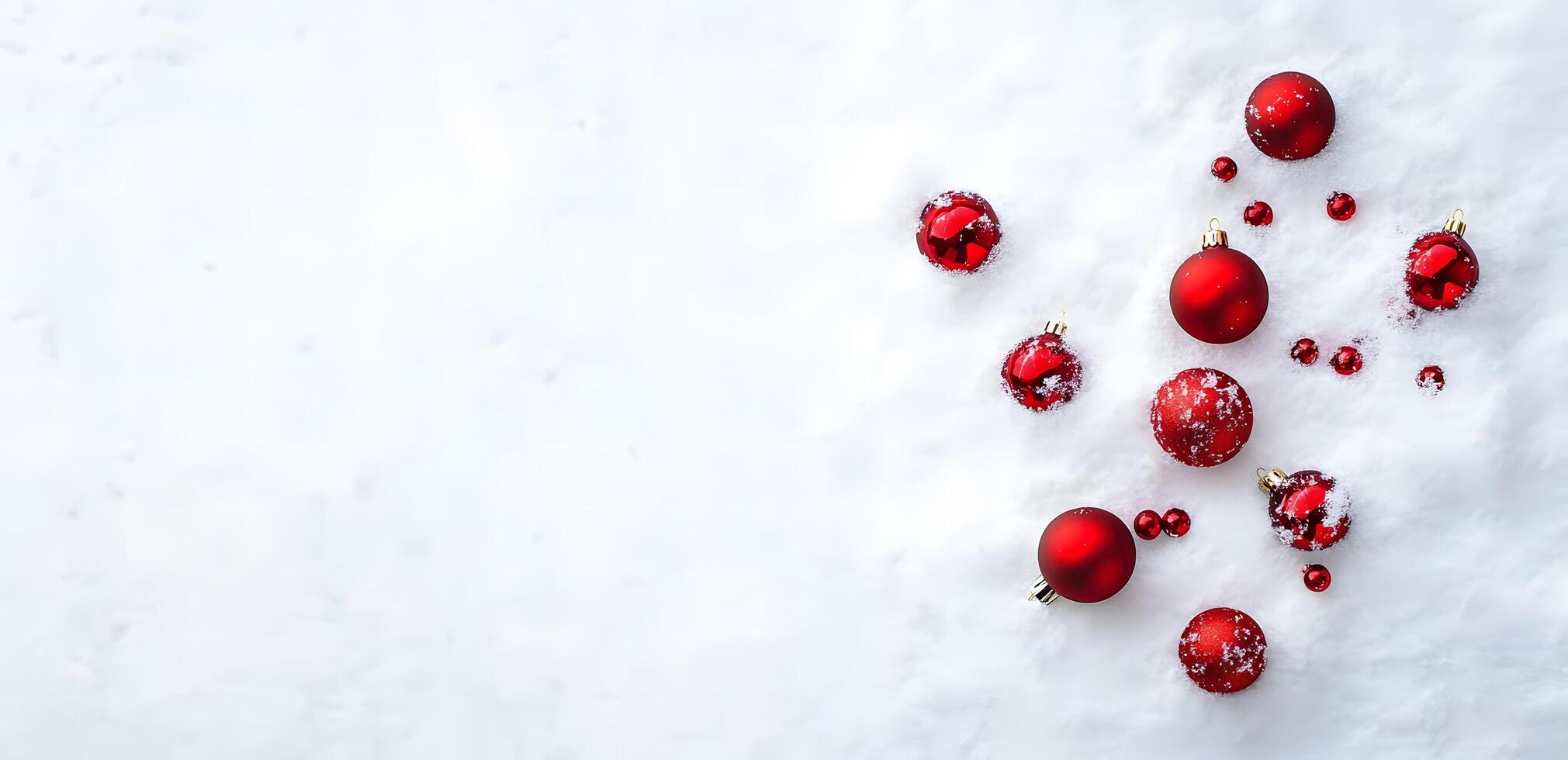 Red Christmas ornaments are scattered across a fresh layer of snow outdoors for holiday cheer photo
