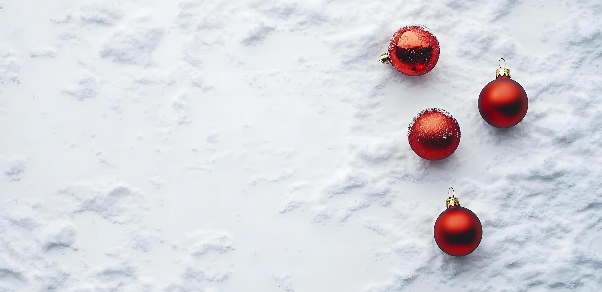 Vivid red Christmas baubles rest delicately upon a pristine, snowy expanse, suggesting winter serenity photo