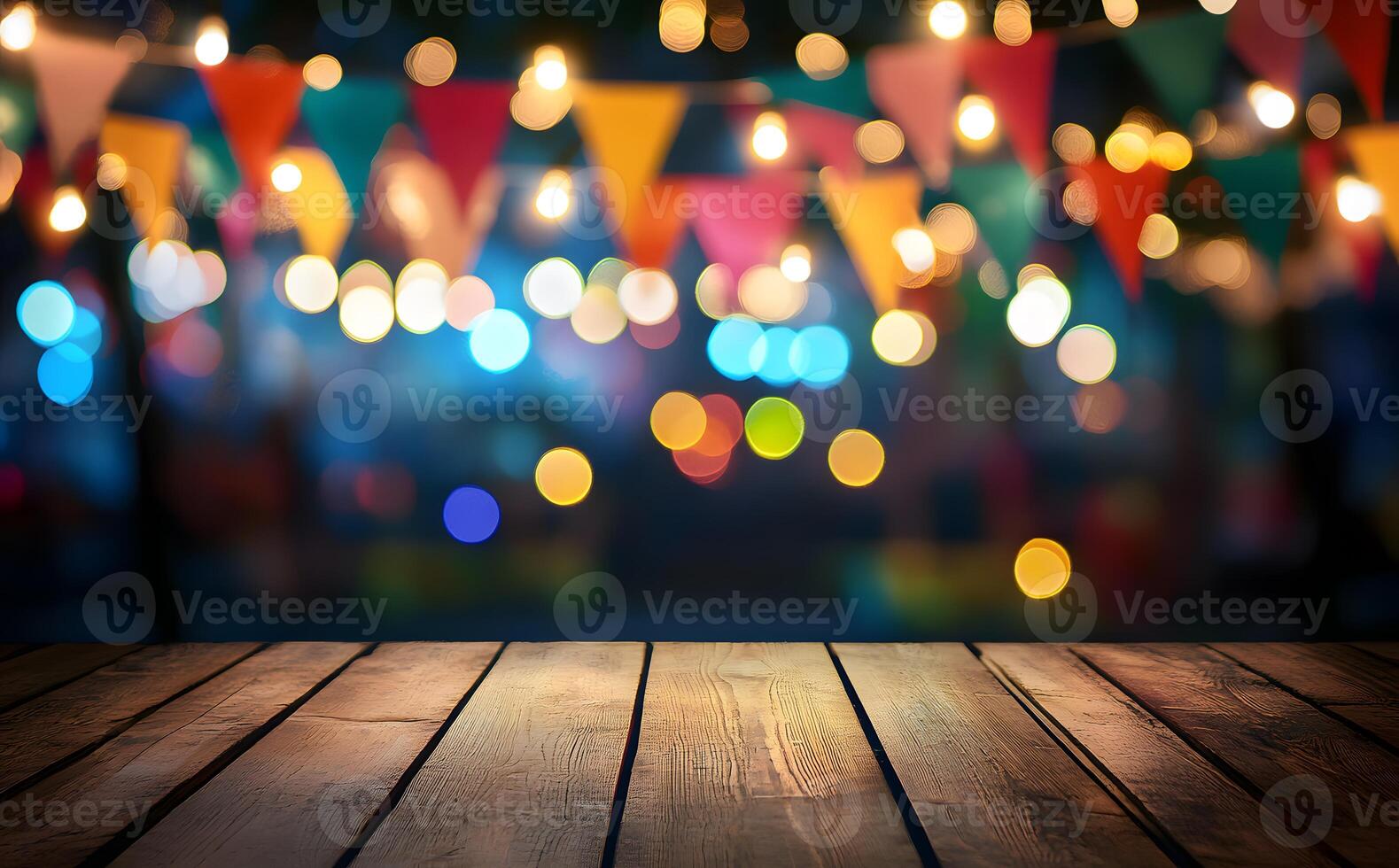 Rustic wood table shows a festive party background with colorful bokeh and flags photo