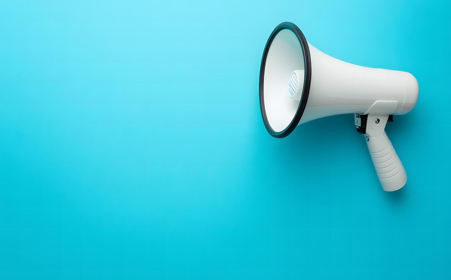 A white megaphone with a handle rests isolated on a vibrant light blue background photo