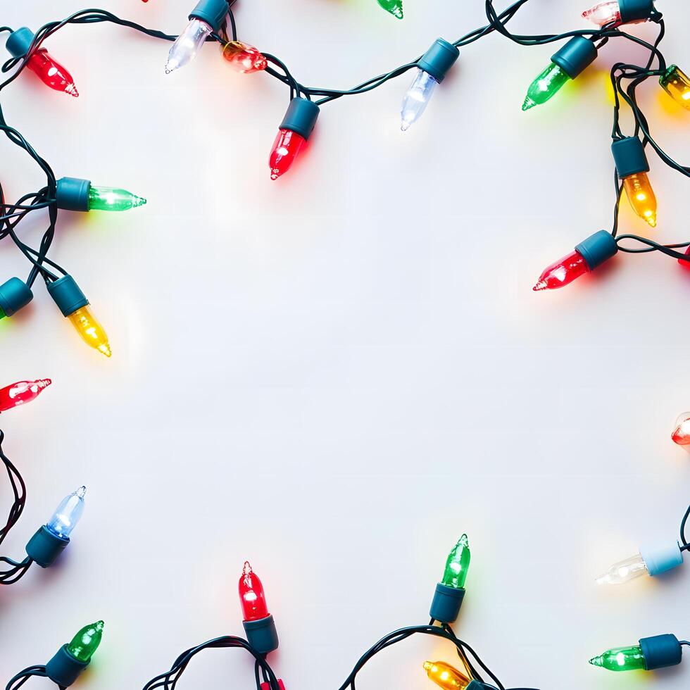 Colorful Christmas lights are framing a blank white canvas beautifully for greetings photo