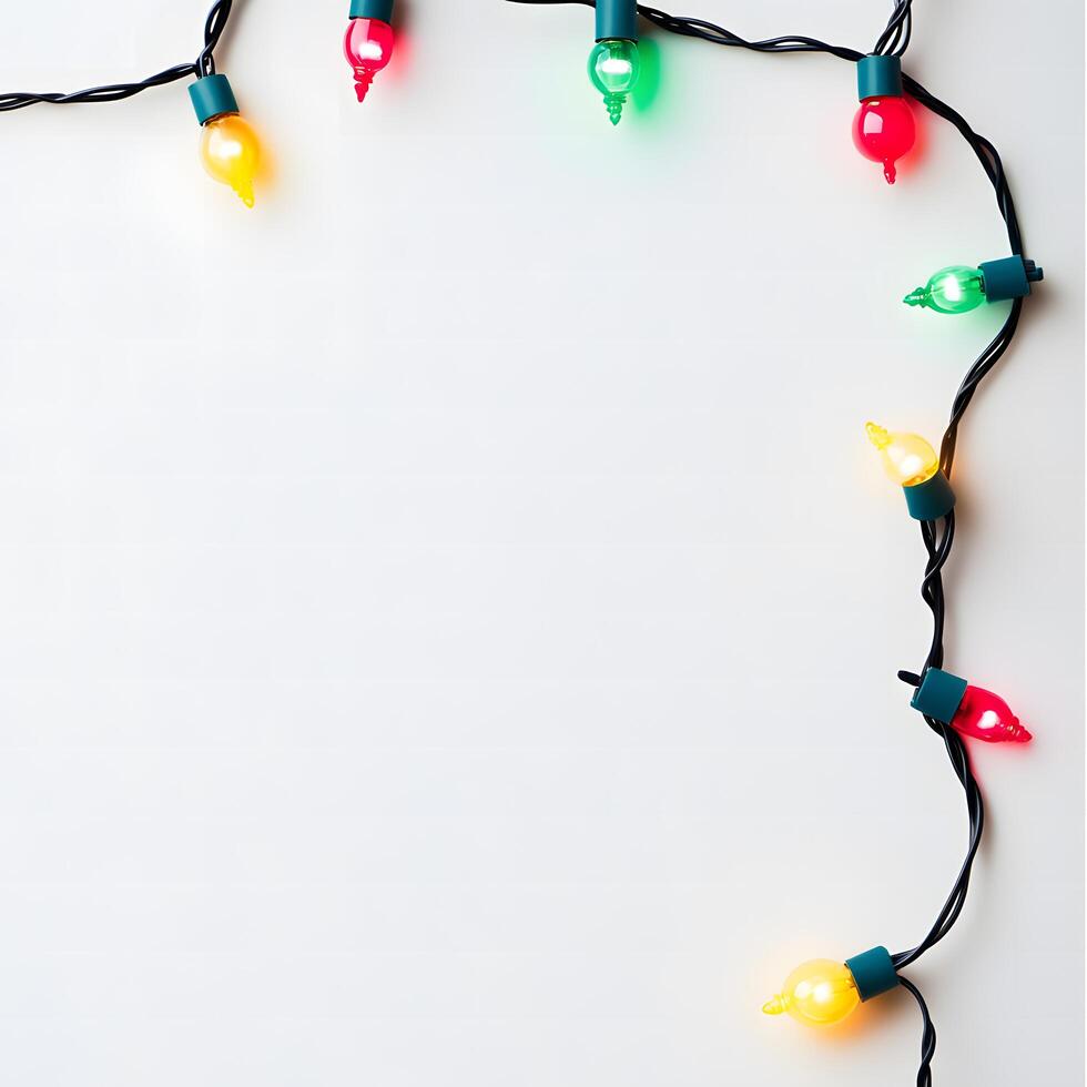 Vibrant yellow, green, and red Christmas light strand is set on a plain white background photo