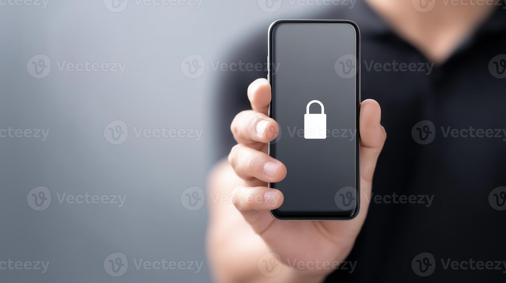 A person holding up a smartphone with a lock on it photo