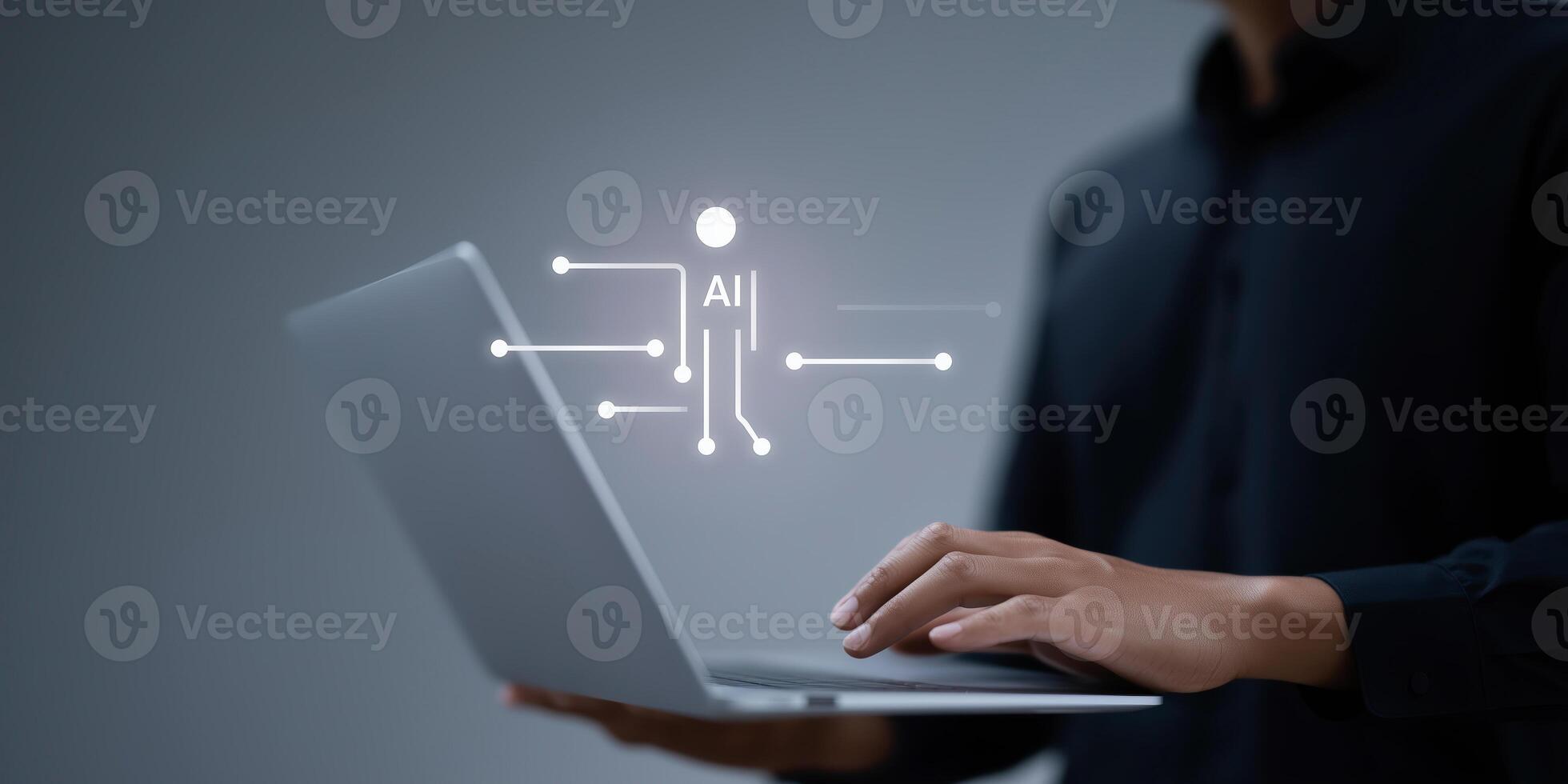 Man using laptop with icons on screen photo