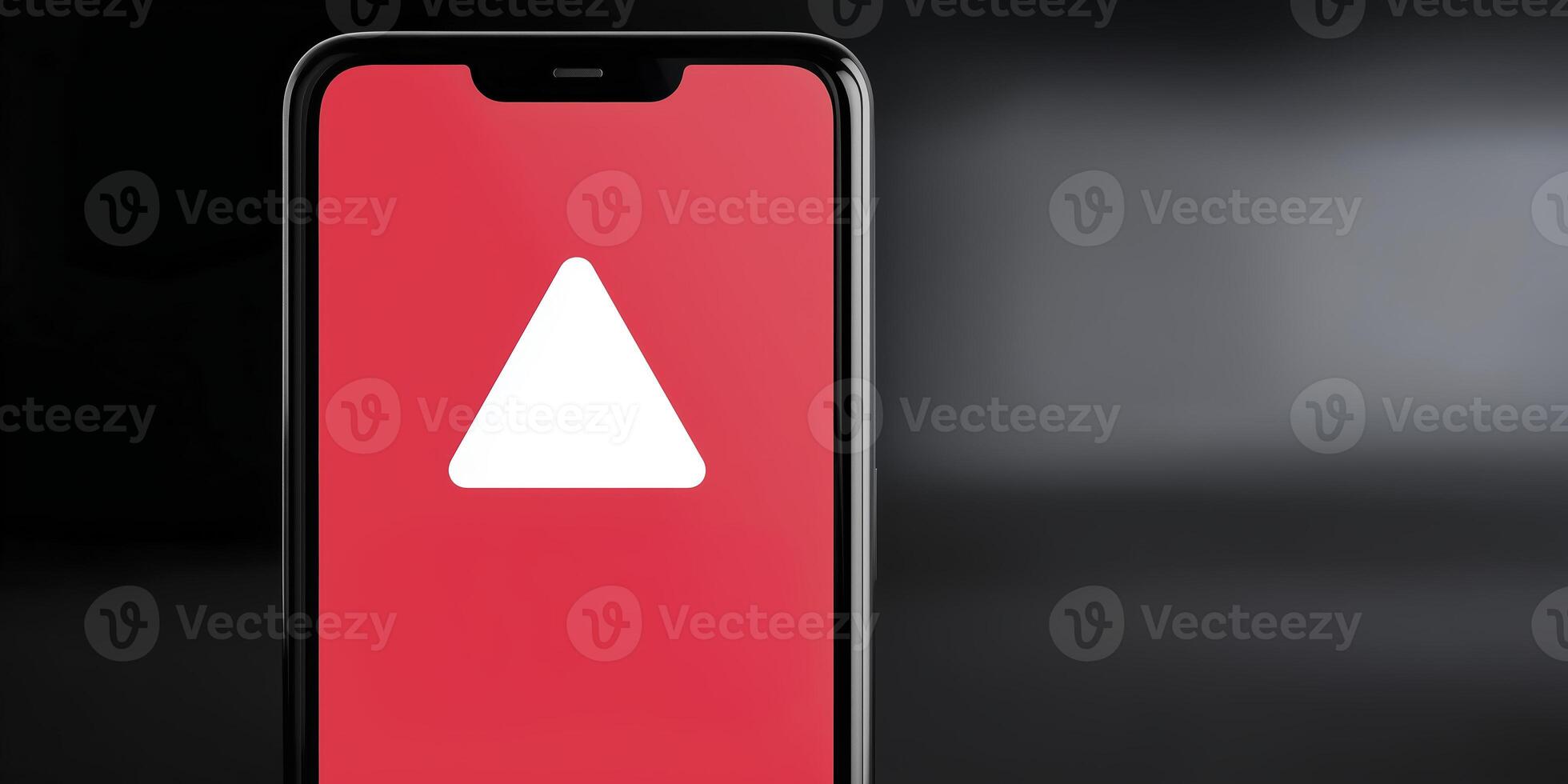 A smartphone with a red triangle on the screen photo