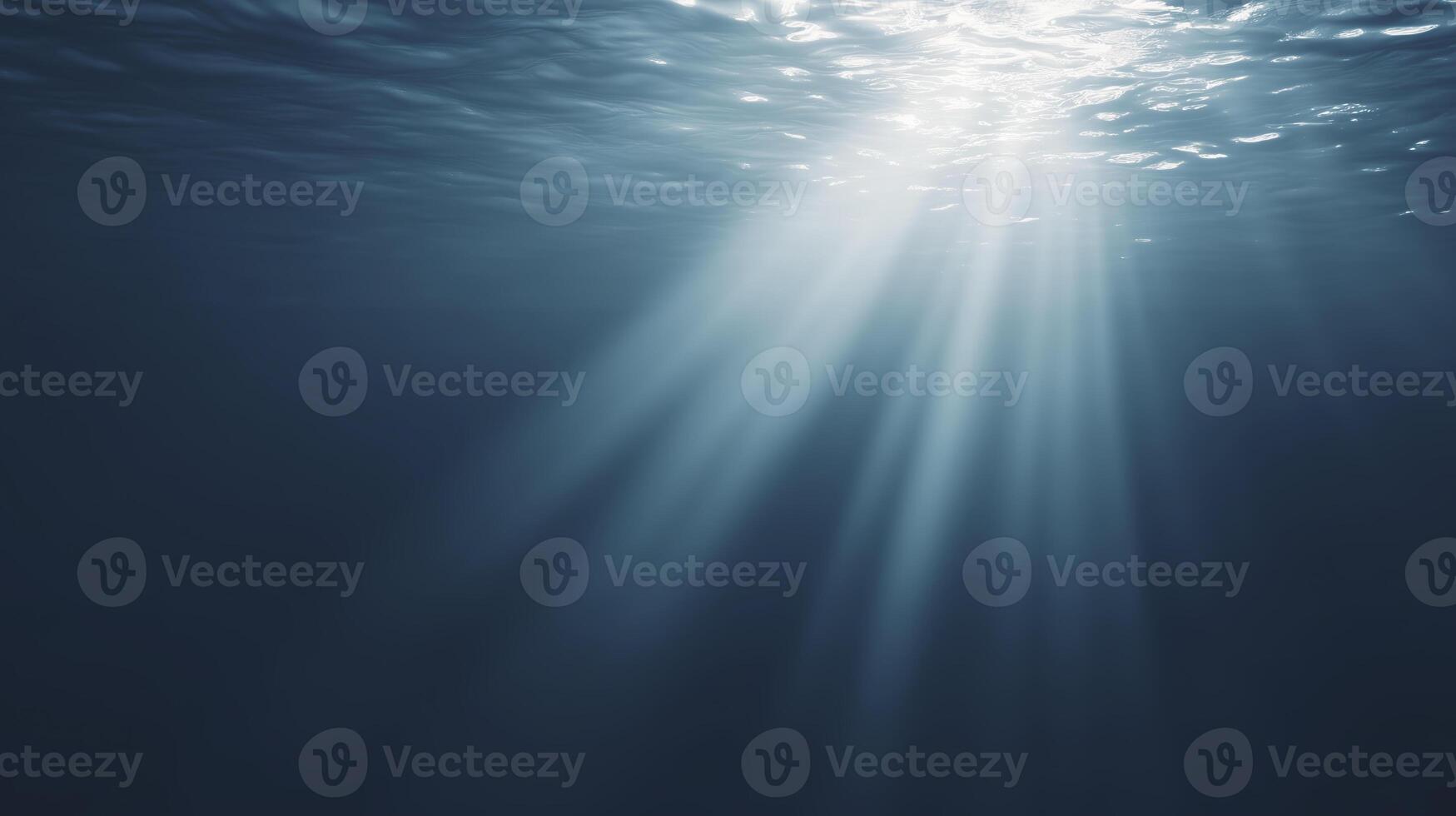 Underwater scene showcasing sunlight rays penetrating the surface, creating a serene atmosphere with shimmering reflections and deep blue hues, evoking tranquility and natural beauty photo