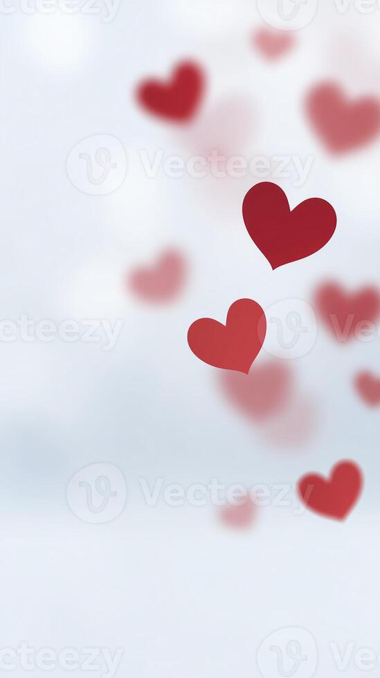 Red hearts floating gently against a soft blurred background, creating a romantic and dreamy atmosphere, perfect for expressing love and affection in various designs photo