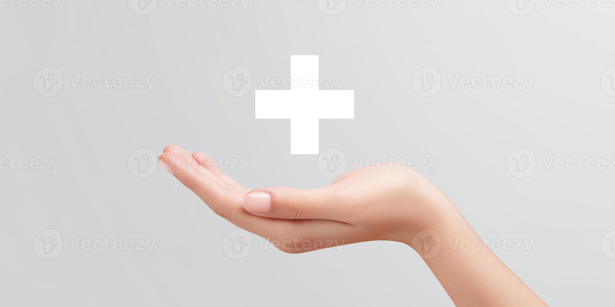 Hand holding white cross symbol on grey background photo
