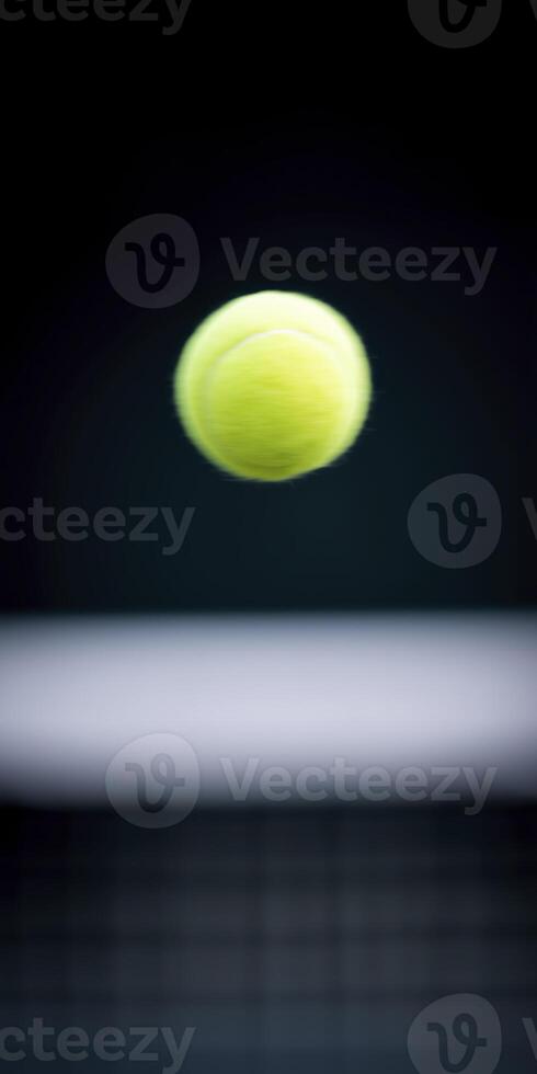 Bright yellow tennis ball is captured mid-air against a blurred background, showcasing its texture and motion, symbolizing the excitement of the game and athleticism in sports photo