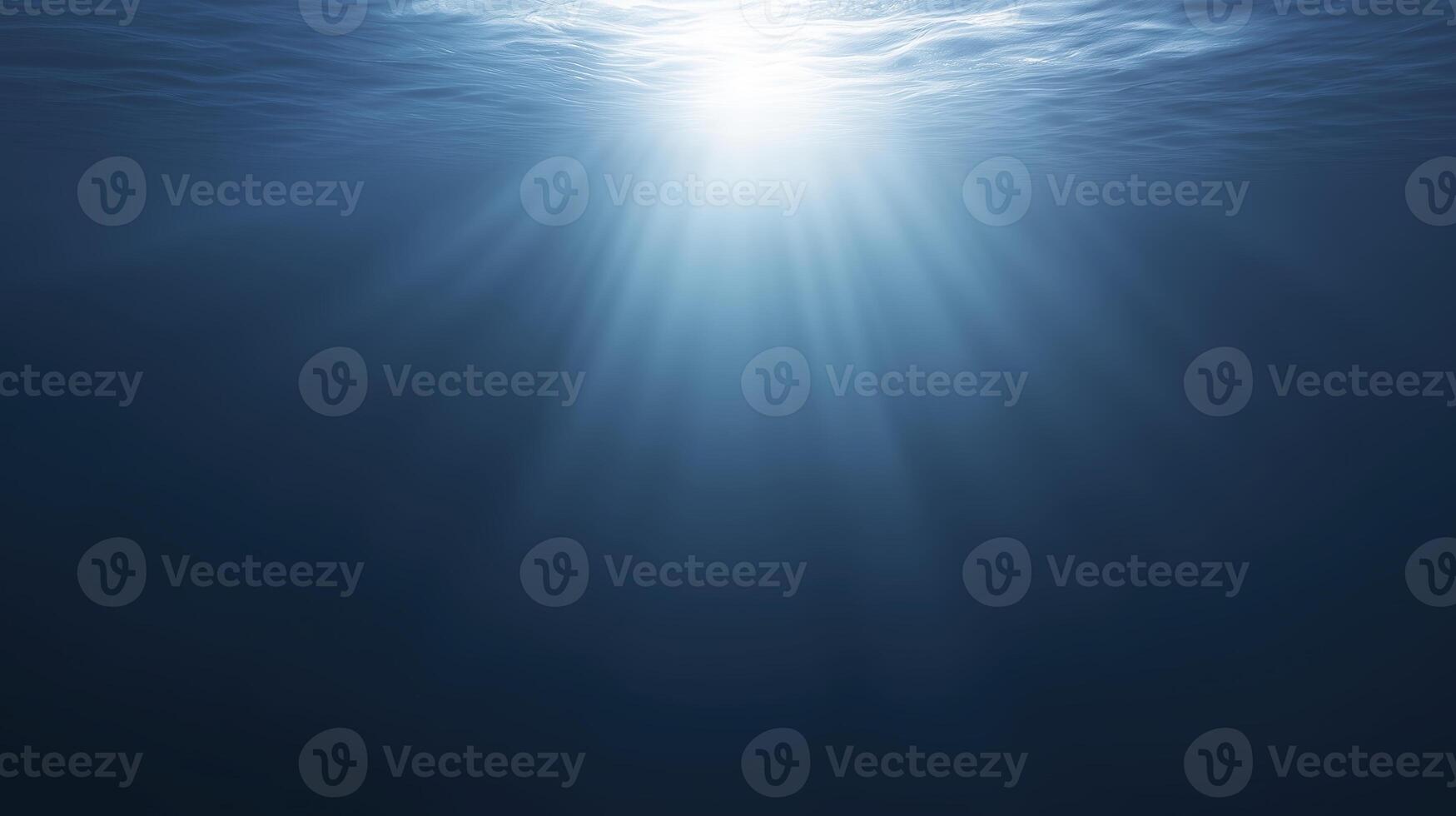 Underwater scene showcasing sunlight penetrating the surface, creating a serene atmosphere with gentle waves and deep blue hues, evoking tranquility and calmness in aquatic environments photo