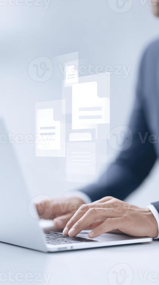 Professional hands typing on laptop with floating digital documents and files representing modern technology and data management in a professional environment photo