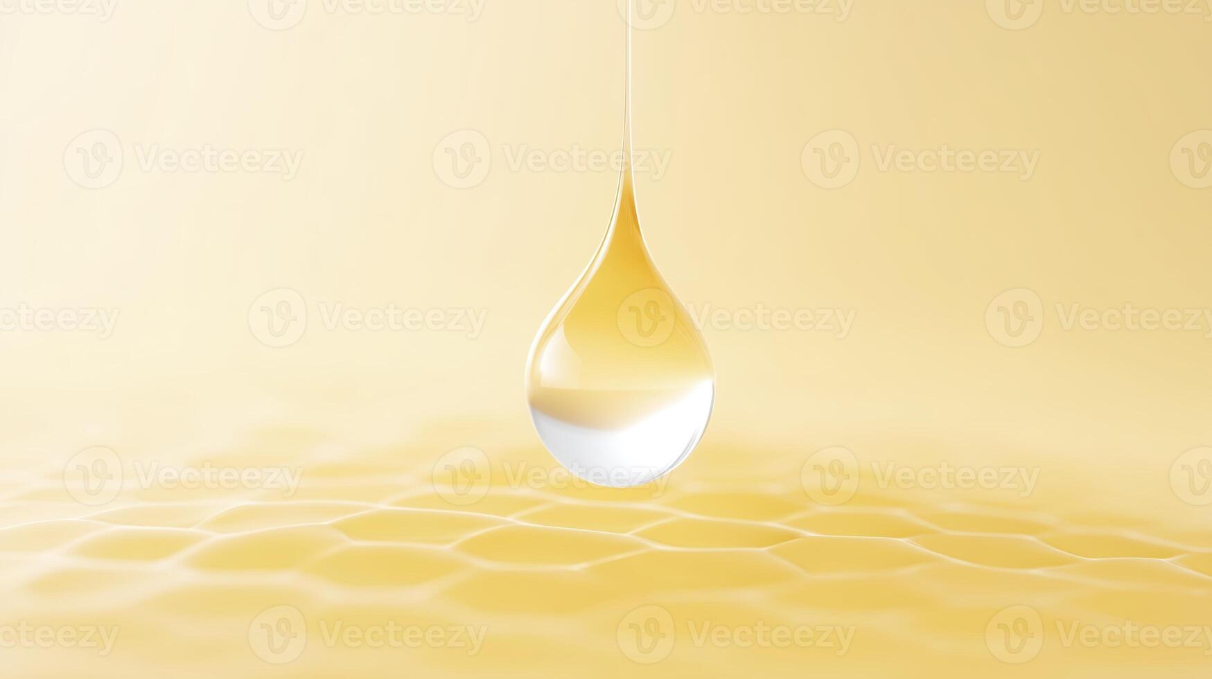 A drop of honey is hanging from a honeycomb photo