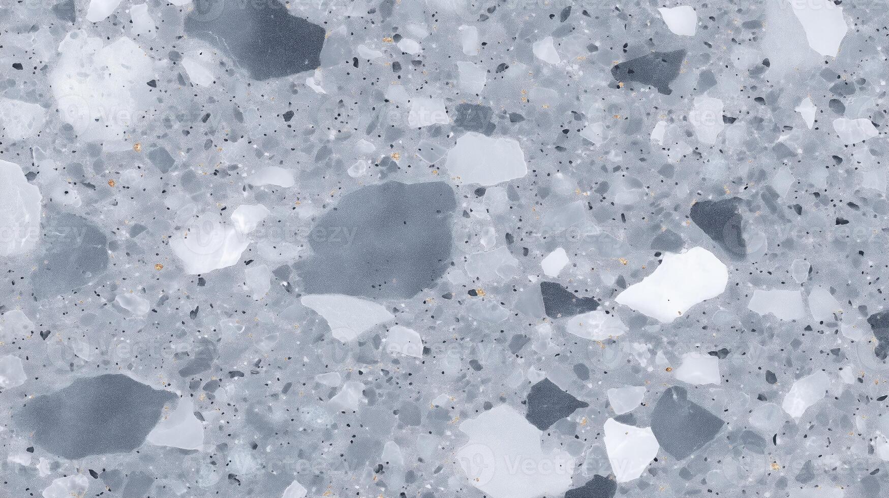 Textured gray terrazzo flooring featuring a mix of white and dark stone chips, creating a modern and stylish surface ideal for contemporary interior design projects photo