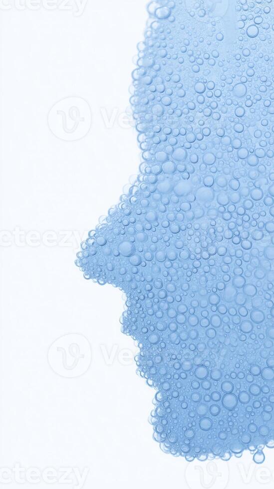 Abstract representation of a human face created with blue water droplets, showcasing the interplay of light and texture against a soft white background, evoking emotions and thoughts photo
