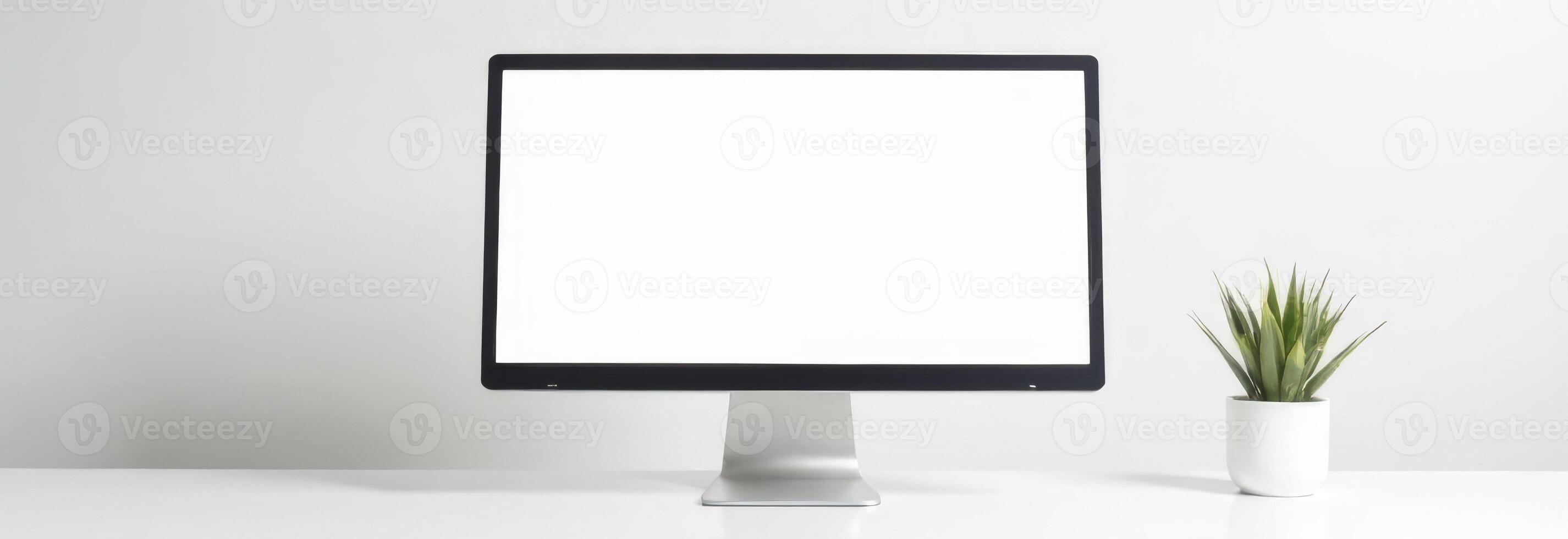 Modern computer monitor on a clean desk with a small potted plant, showcasing minimalistic workspace design and technology aesthetics, workspace concept photo