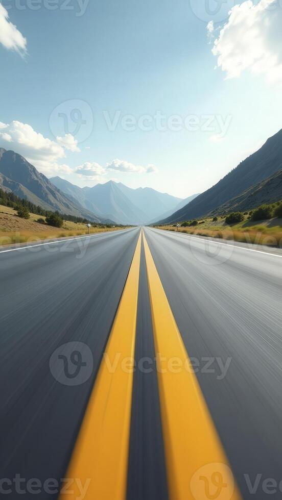 Open road leading into mountain valley on sunny day photo