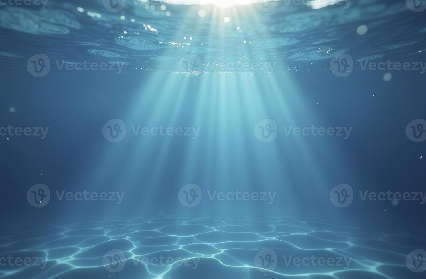 Underwater sunlight illuminating ocean floor with gentle ripples photo