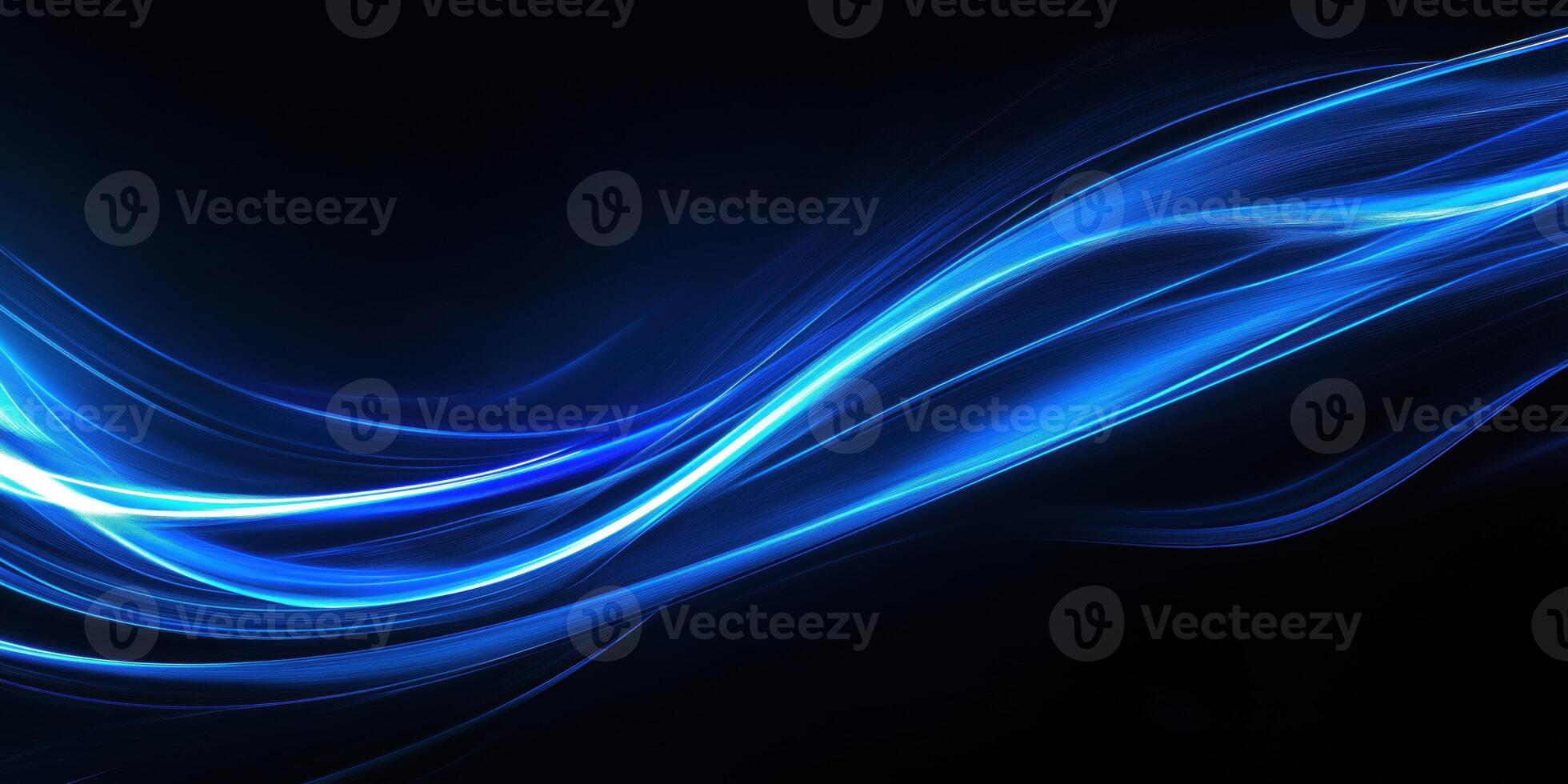 Abstract blue light trail streaking across black background photo