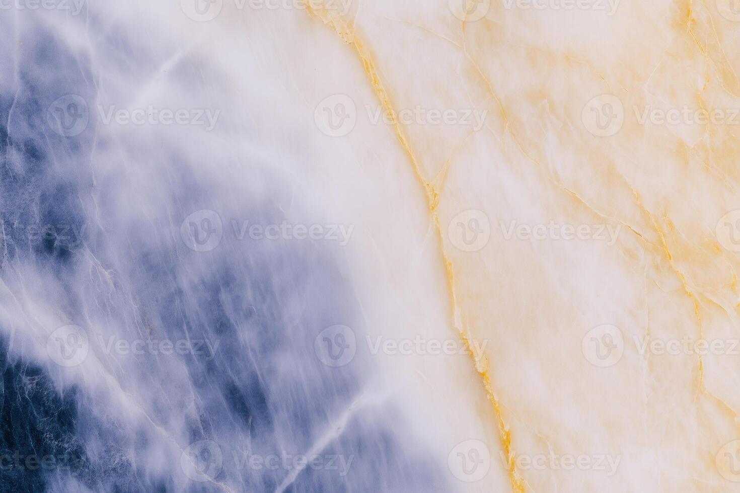 Elegant blue and yellow marble texture with natural patterns and subtle veins photo