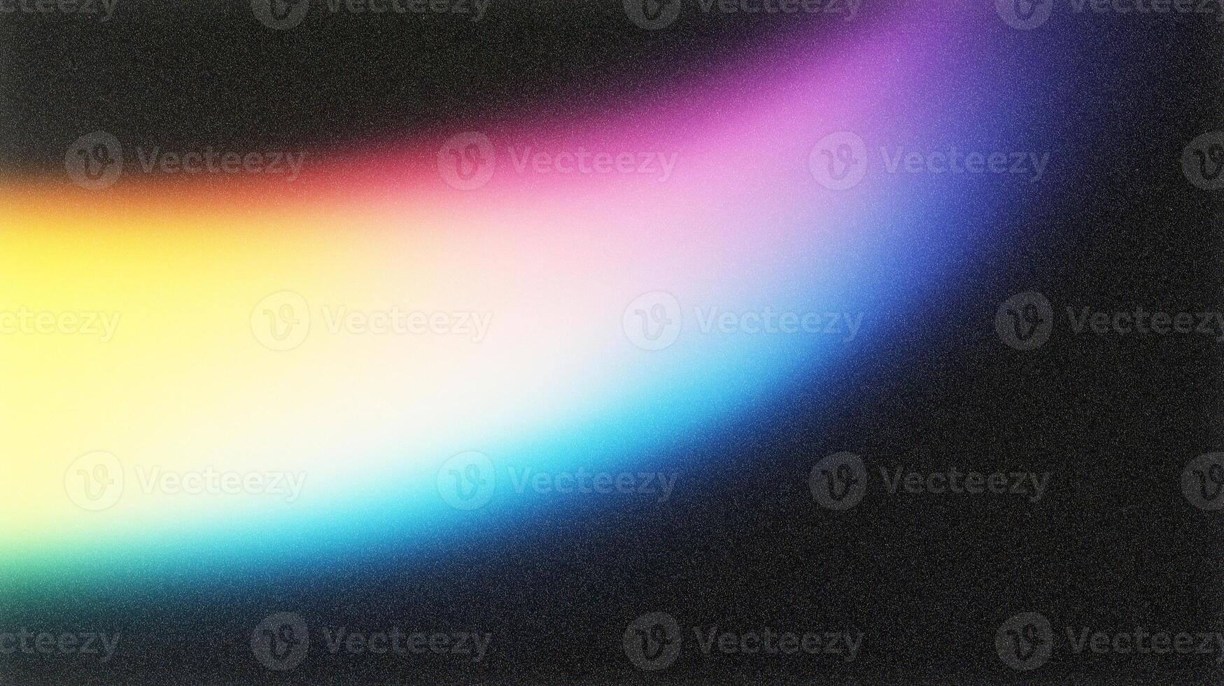 Colorful light leak creating a spectrum gradient on dark background photo