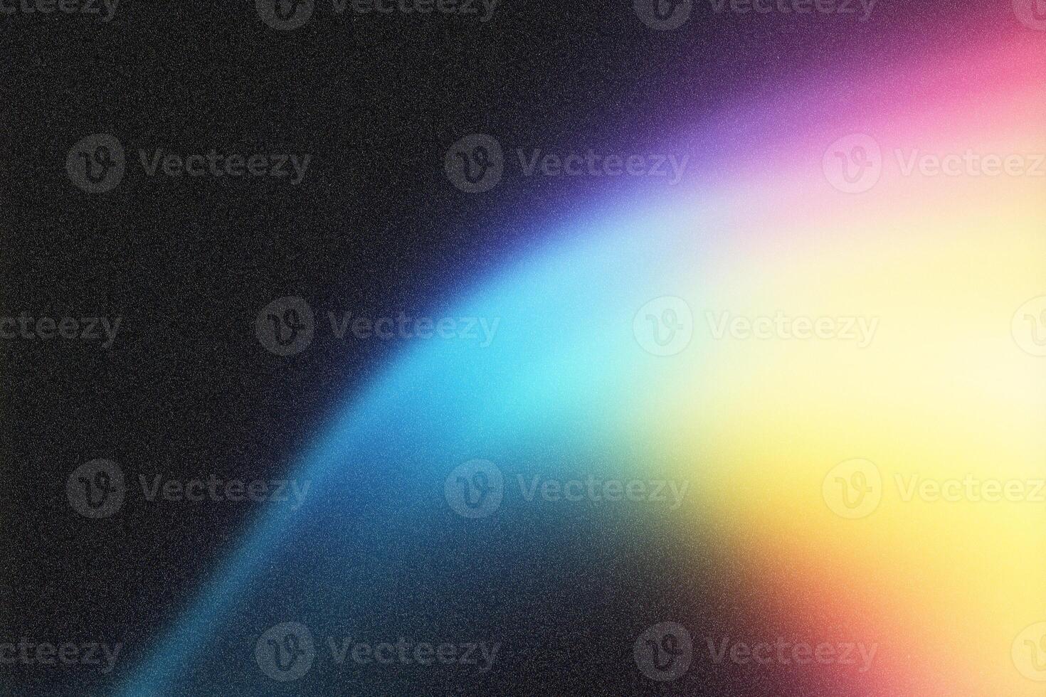 Light painting a colorful gradient on dark textured background photo