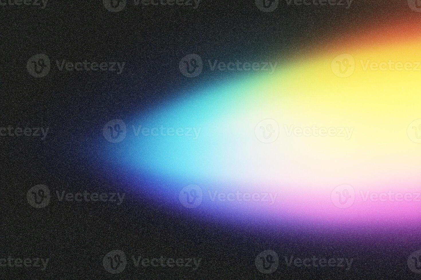 Light beam forming diagonal gradient on black background photo