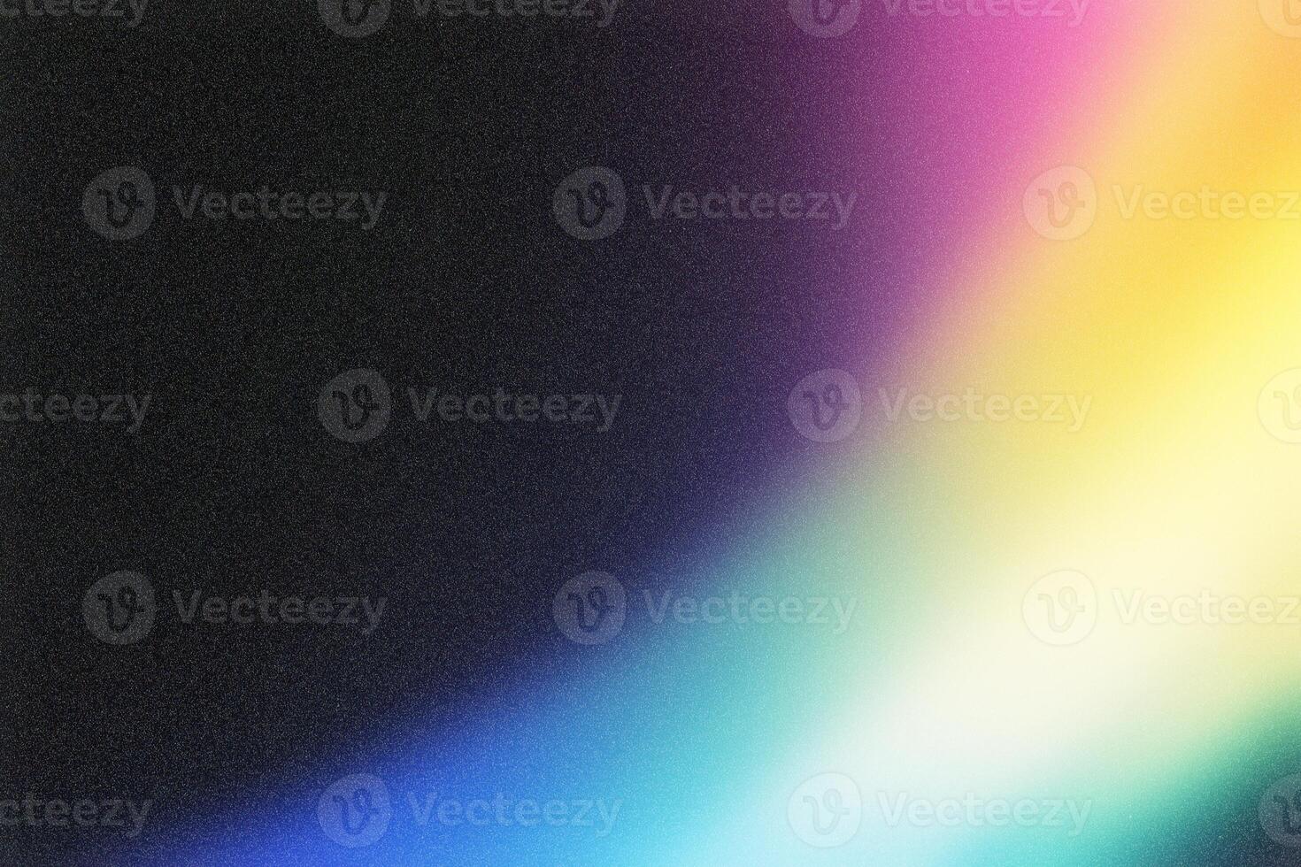 Colorful gradient background fading from black with grain texture photo