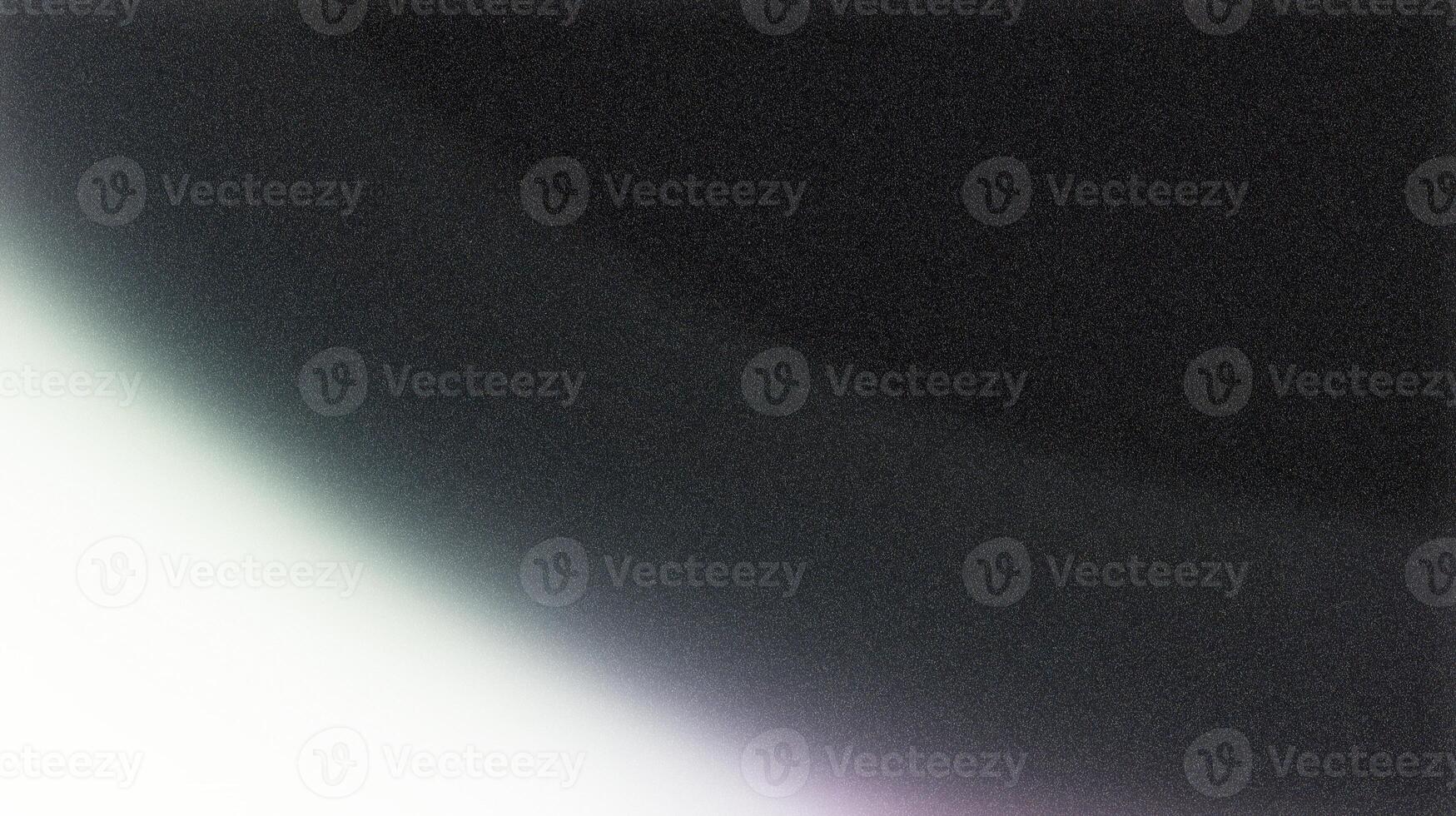 Light leak creating gradient on black grainy background photo