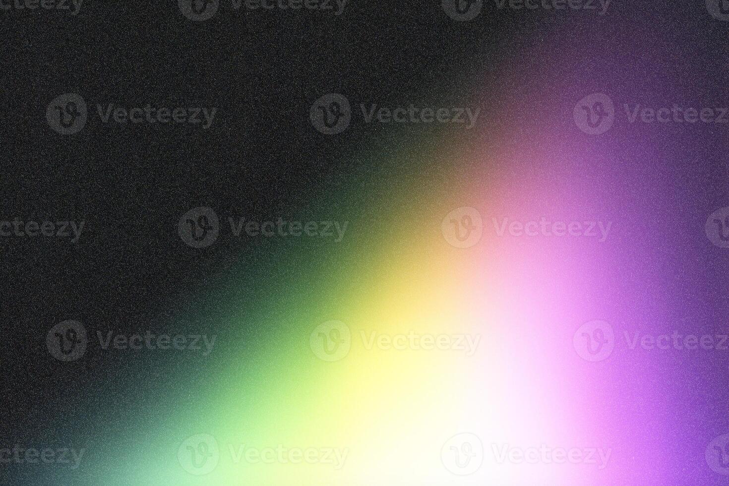 Colorful gradient fading into dark grainy background photo