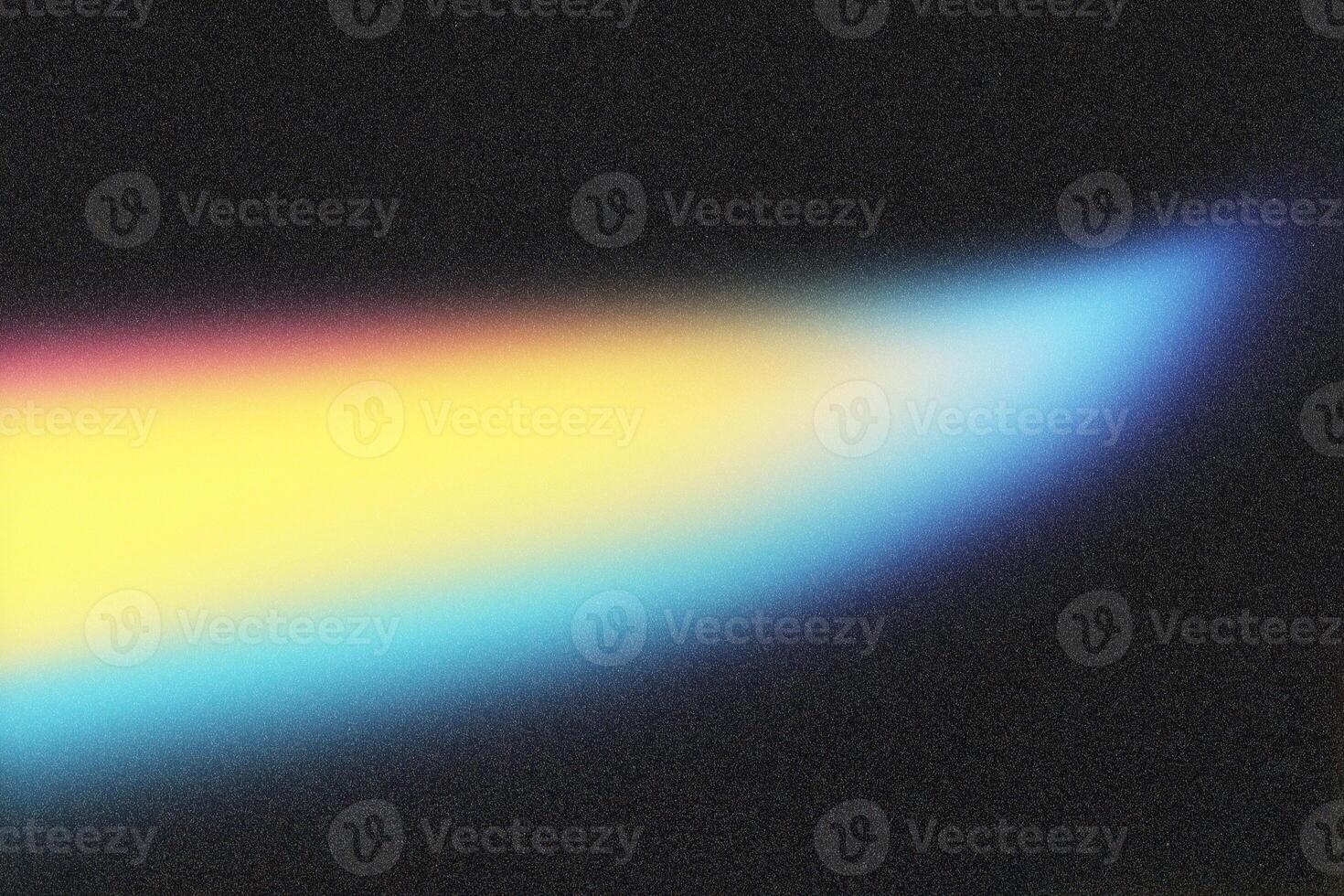 Light painting a colorful blur across a textured black background photo