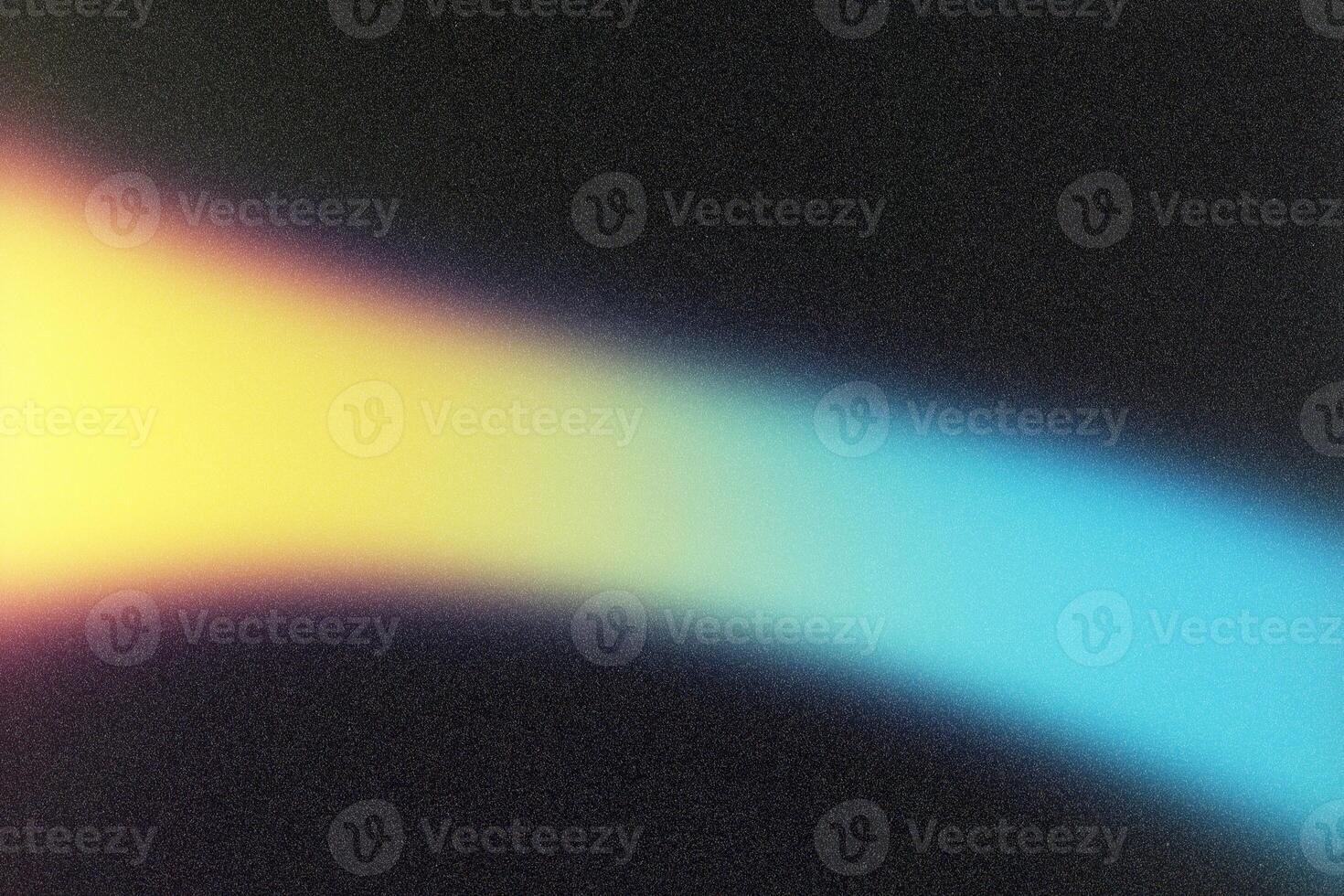 Light beam creating colorful gradient on black background photo