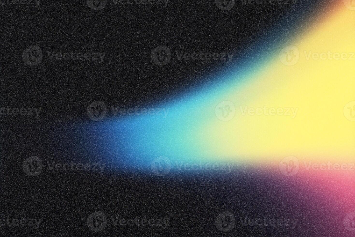 Light beam crossing dark background with blue, green, yellow and pink color gradient photo