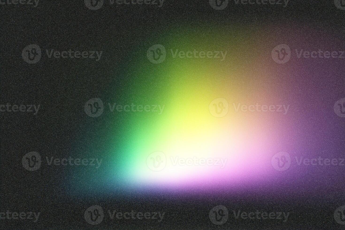 Colorful light gradient fading on dark textured background photo