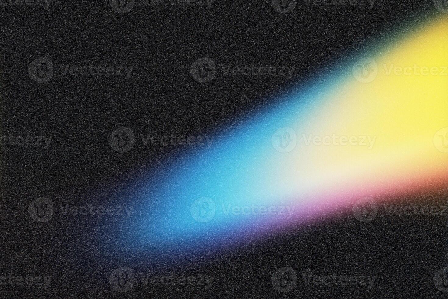 Light beam creating colorful gradient on dark background photo
