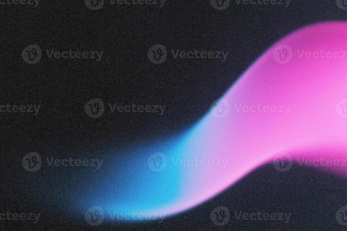 Abstract pink and blue light painting on black background photo