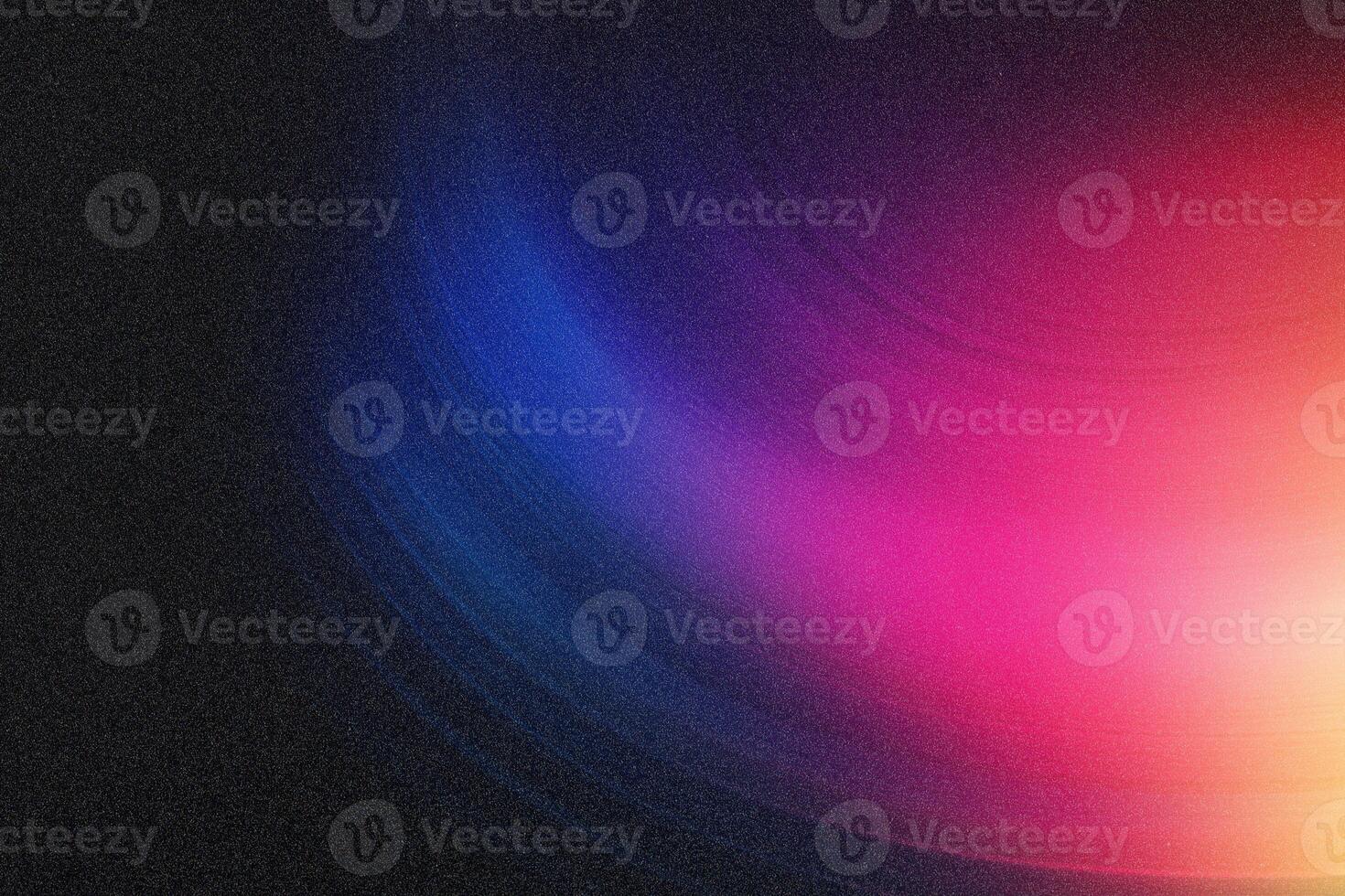 Colorful abstract background blending blue pink and orange with film grain photo
