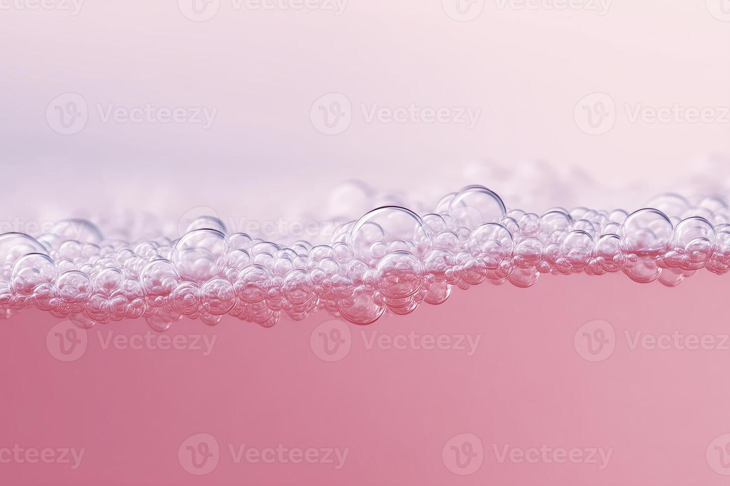 Bubbles of soap on pink background photo