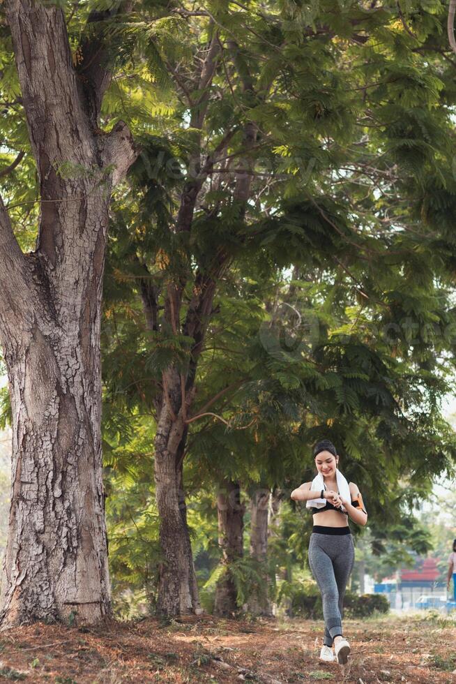 A woman is running in the park photo