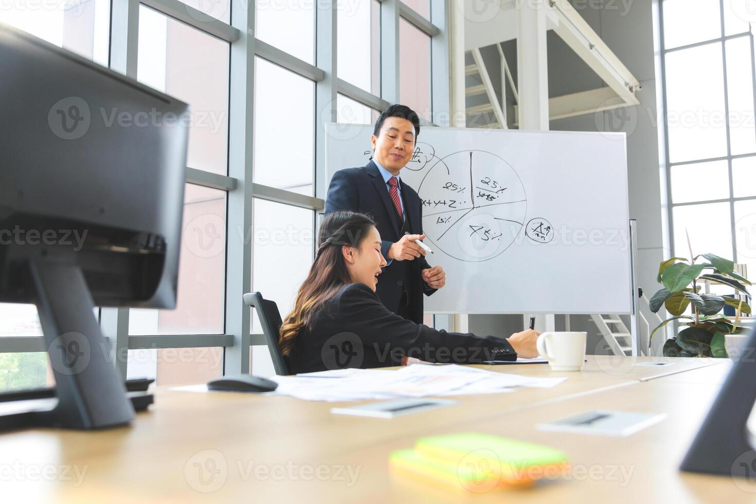 Supervisor training and suggesting about work to colleagues, Businesspeople team meeting in modern office, Asian professional business meeting in office, Teamwork and brainstorming concepts photo
