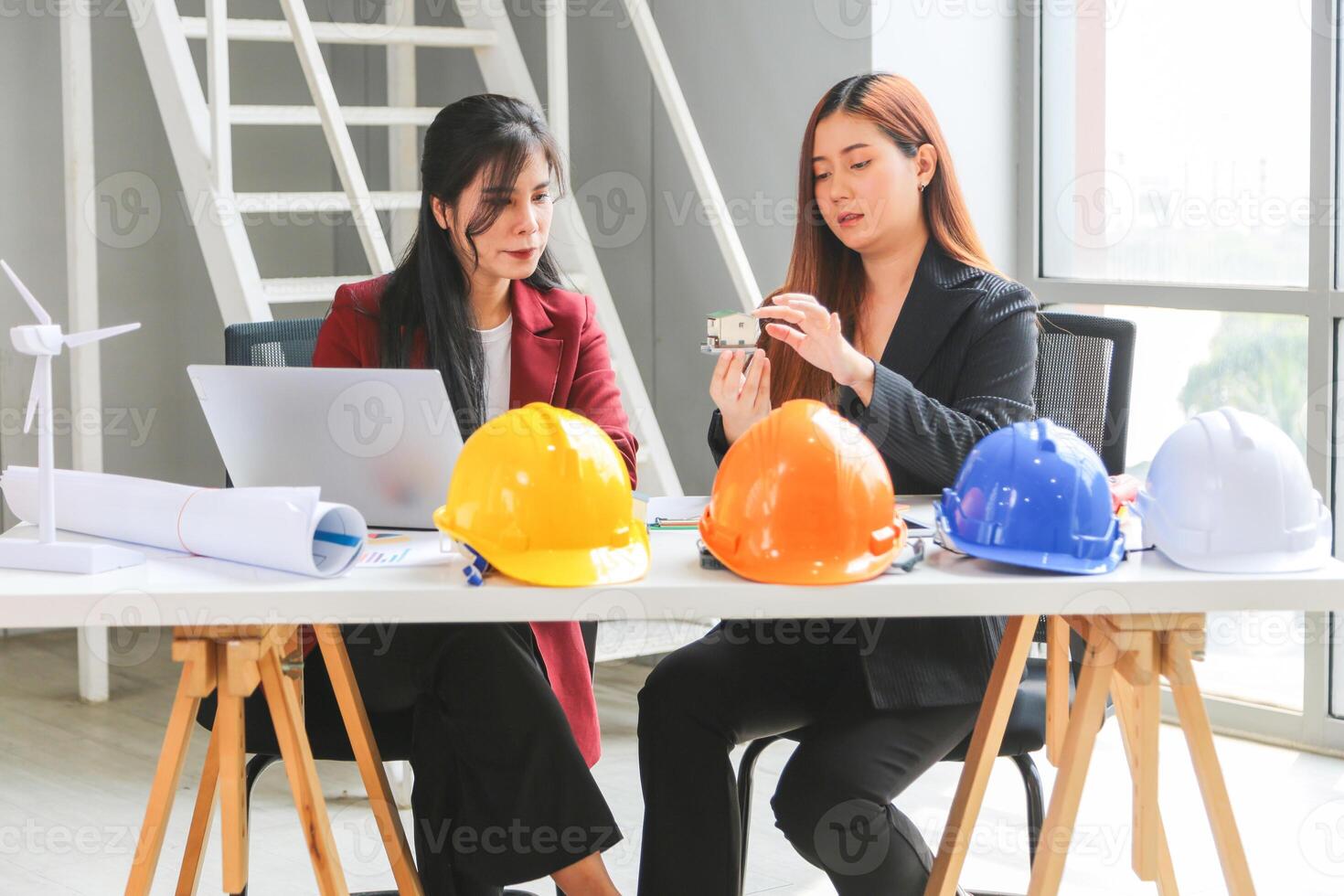 Female engineer and architecture working meeting and brainstorming together at project site, Business women discussing ideas and planning strategy in office photo